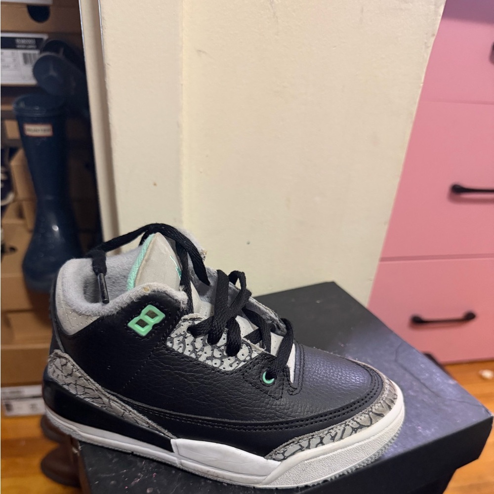 Black and Gray Sneakers with Green Accents